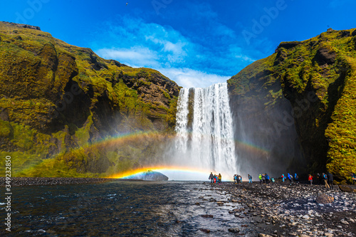 Tourists at the beautiful Skogafoss waterfall in the golden circle of the south of Iceland