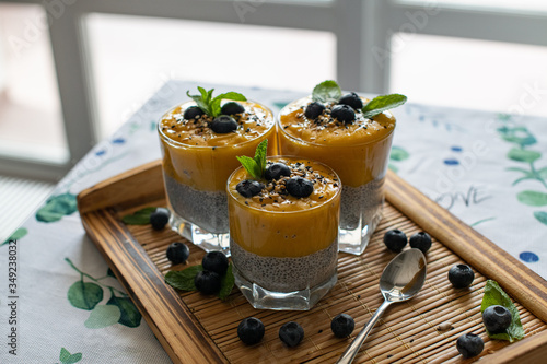 Fresh mango smoothie with blueberries. Healthy diet nutrition. Vegetarian healthy food. Homemade chia pudding. Superfood for strong immunity. Concept of vegetarian breakfast
