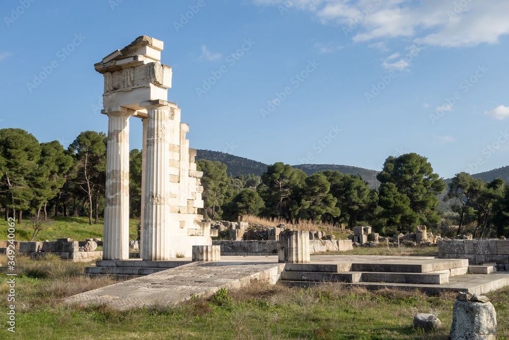 Temple of Asklepios at Epidaurus at early sunset with boulders around