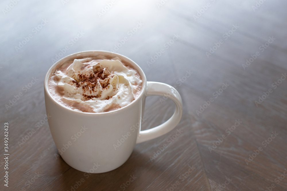 Hot chocolate cocoa with whipped cream on wooden background Hot chocolate cocoa with whipped cream on wooden background