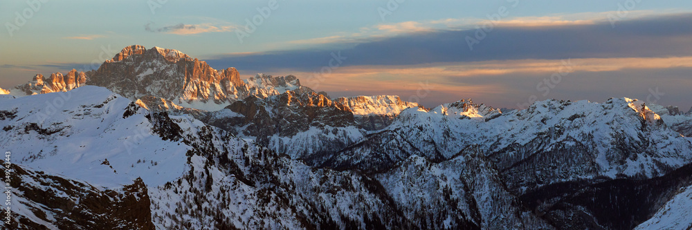 Dramatic panoramic view of the mountains at sunset near Val Gardena ski resort in Italy.