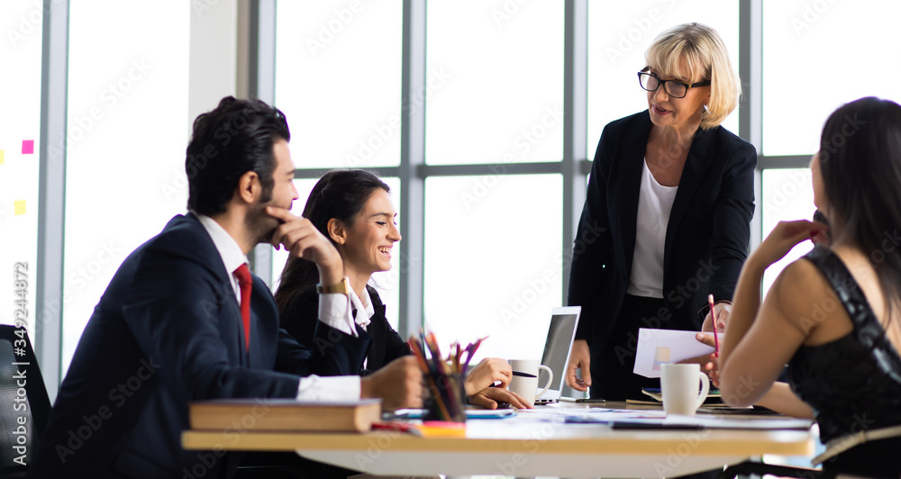 Multiethnic Business people busy working together on business project in modern office. Brainstorming, analyze and discussion concept. Multiethnic Business people busy working together on business project in modern office. Brainstorming, analyze and discussion concept.