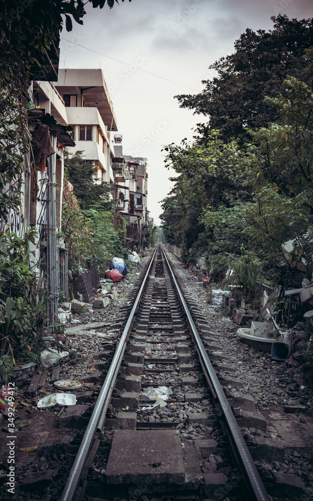 a railway that divides the city into several parts with a passing train