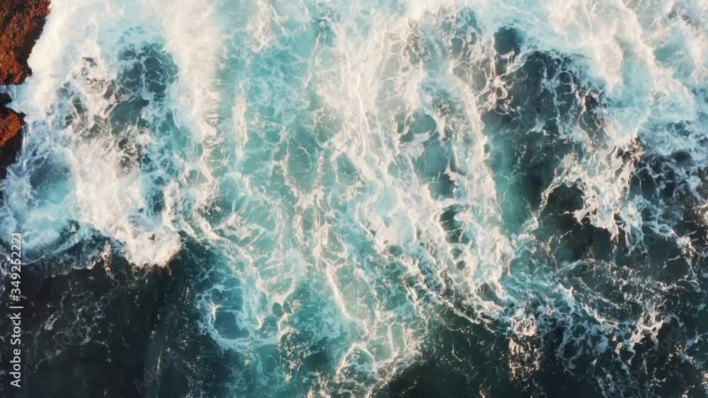 Beautiful transition of spray and foam from sea waves shimmering in the rays of the setting sun Beautiful transition of spray and foam from sea waves shimmering in the rays of the setting sun
