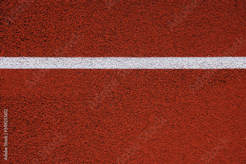 Colorful sports court background. Top view to red field rubber ground. texture © Igor Link