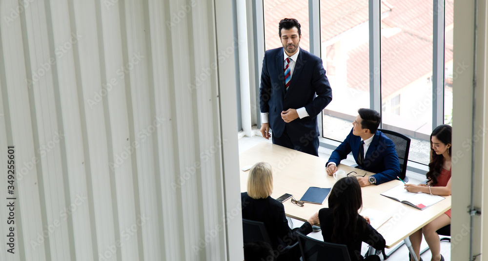 Top view group of multiethnic business man and woman busy working and meeting in conference room. people work in modern office. Professional business team success. Top view group of multiethnic business man and woman busy working and meeting in conference room. people work in modern office. Professional business team success.
