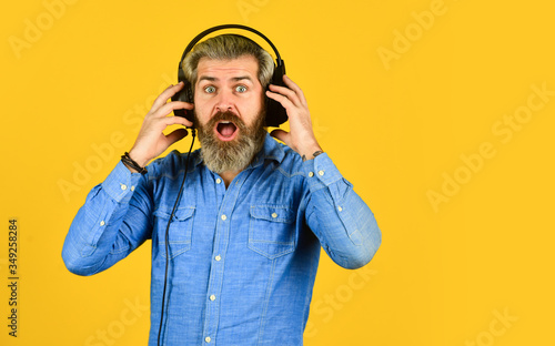 wow. his favorite song. enjoy excellent sound song in earphones. good mood playlist. Man with headset. copy space. bearded man hipster in headset. listen audio book. Music beat for energetic mood photo