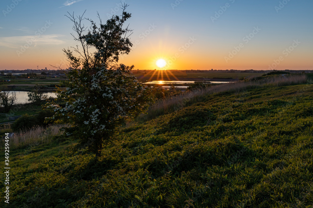 The setting sun over The Hague, seen from the hills in the Buytenpark in Zoetermeer