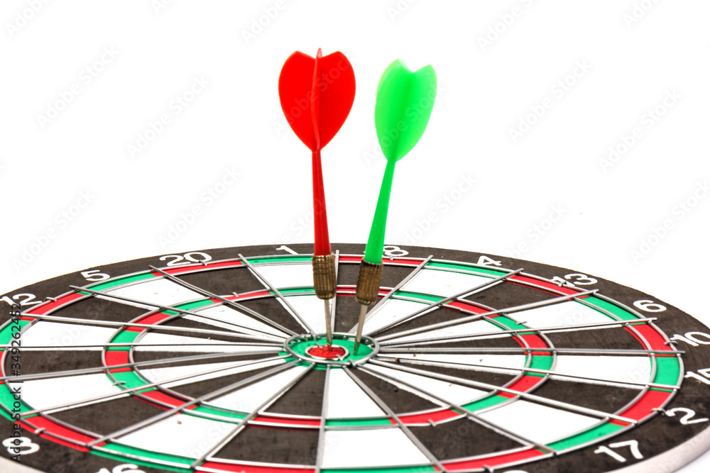 Dartboard with darts on white background, closeup. Purpose concept Dartboard with darts on white background, closeup. Purpose concept