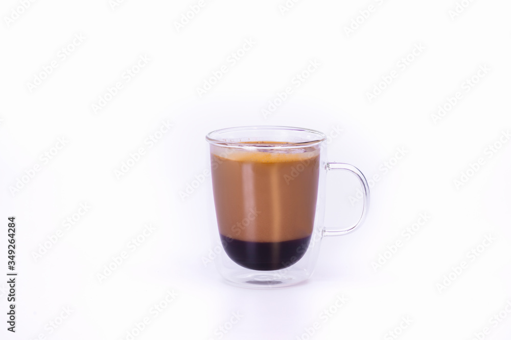 view of a glass cup with a capuccino view of a glass cup with a capuccino