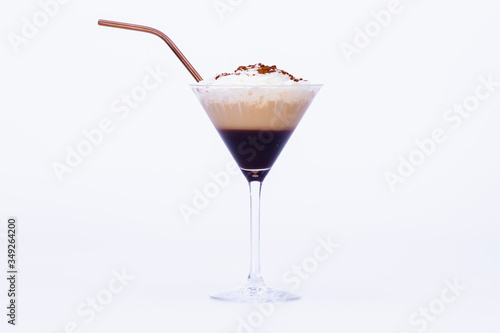 cocktail glass with a delicious capuccino with straw