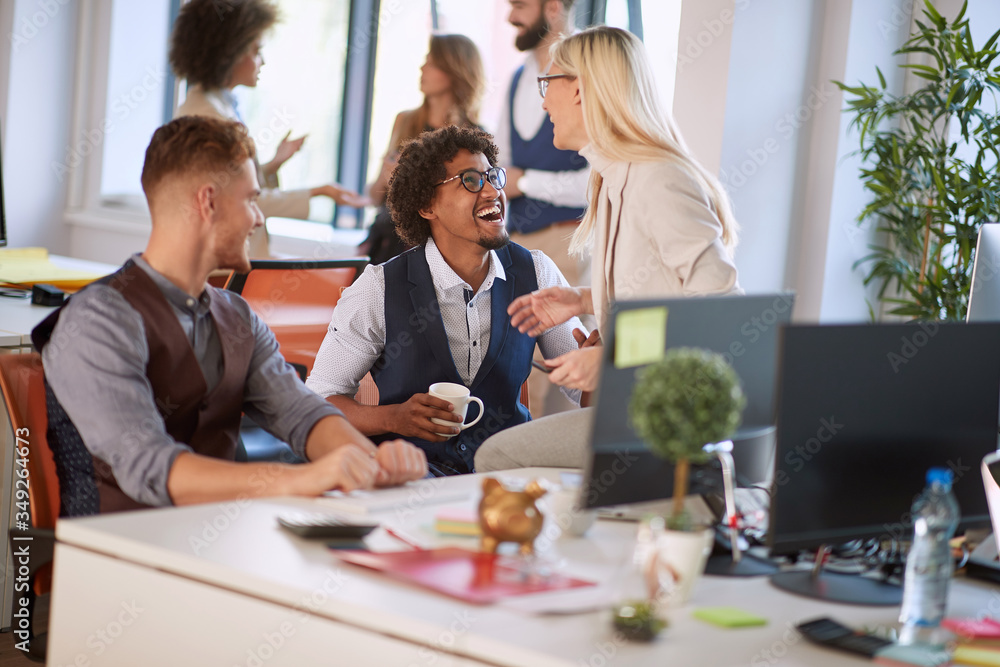 Coworkers having a laugh on a break. Colleagues on a coffee break. Coworkers having a laugh on a break. Colleagues on a coffee break.