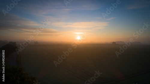 sunrise over farmland and fields