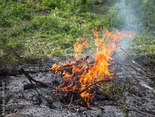 Bonfire during the day on a camping trip