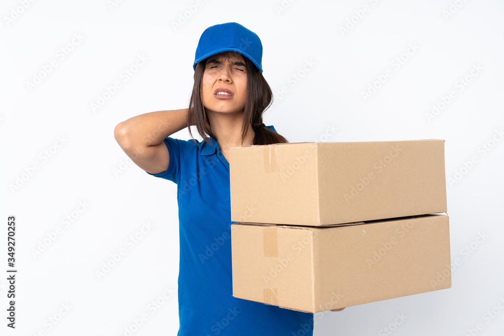 Young delivery brunette girl over isolated white background with neckache Young delivery brunette girl over isolated white background with neckache