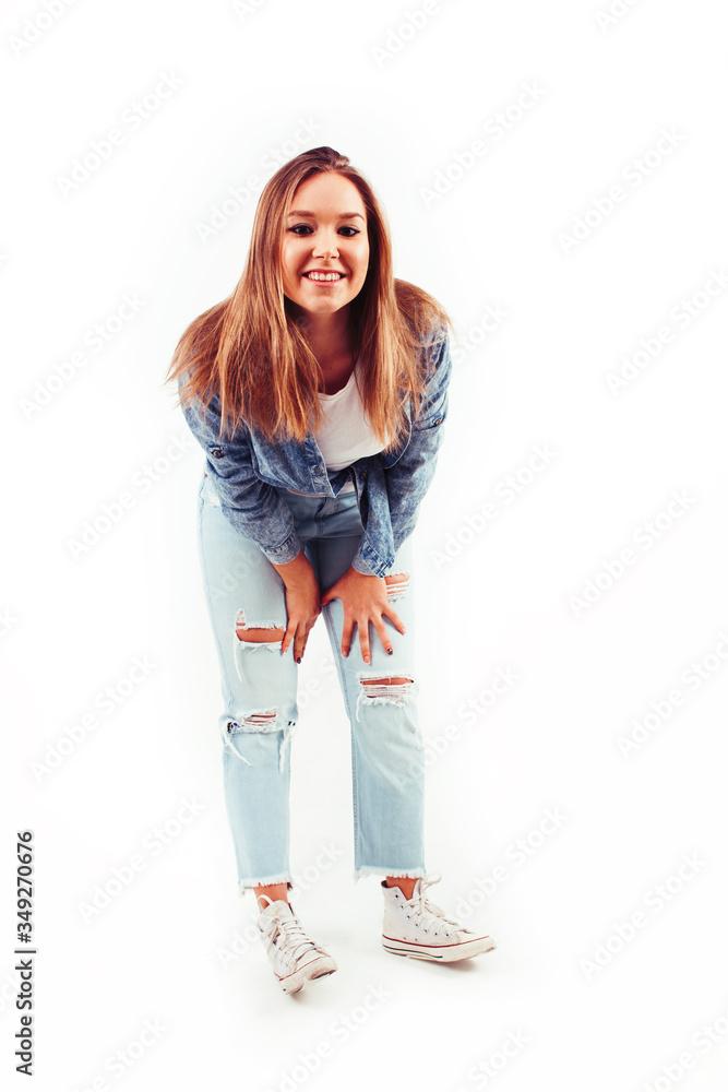 young pretty teenage hipster girl posing emotional happy smiling on white background, lifestyle people concept young pretty teenage hipster girl posing emotional happy smiling on white background, lifestyle people concept