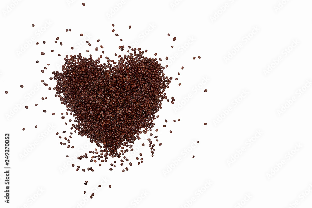 lots of coffee beans scattered in a heart shape on a white background. fried brown coffee beans are scattered on the surface, lovers of coffee drinks, love of coffee lots of coffee beans scattered in a heart shape on a white background. fried brown coffee beans are scattered on the surface, lovers of coffee drinks, love of coffee