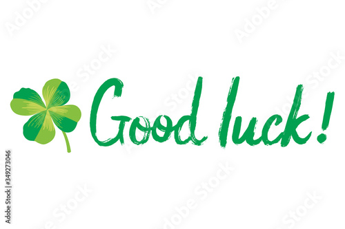 Lettering Good luck with the effect of a dry brush. Four-leaf clover. Greeting card for St. Patrick's Day.