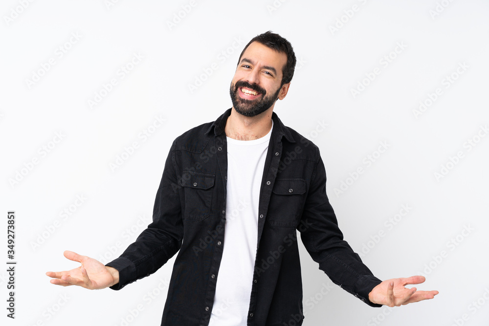 Young man with beard over isolated white background smiling Young man with beard over isolated white background smiling