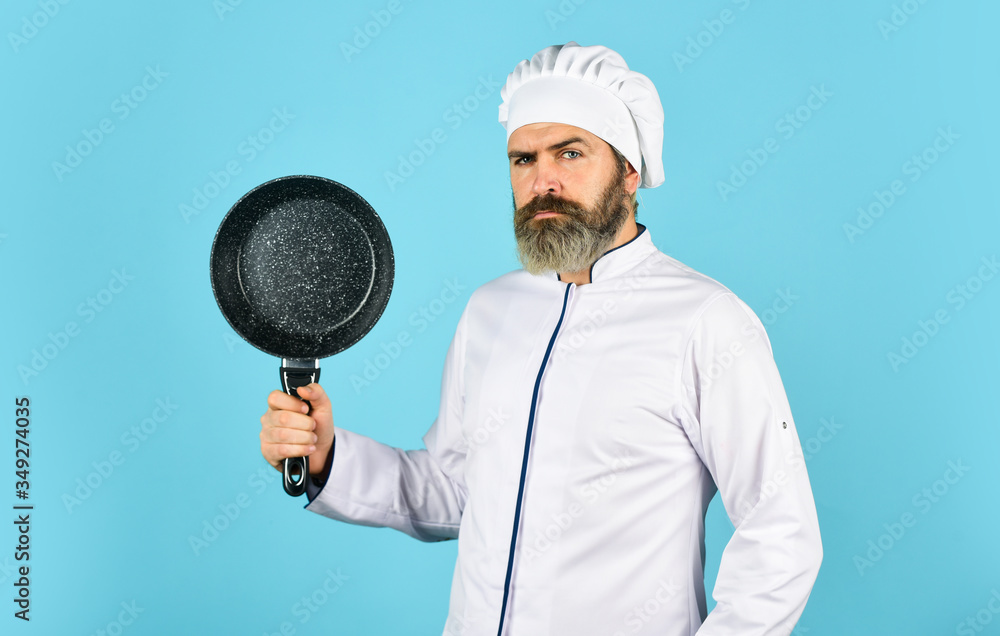 cuisine rich vitamins. preparing food in kitchen. husband in chef hat on kitchen. Cooking food concept. Hold frying pan. best quality. bearded cook in uniform with tools. bearded man hold cooking pan cuisine rich vitamins. preparing food in kitchen. husband in chef hat on kitchen. Cooking food concept. Hold frying pan. best quality. bearded cook in uniform with tools. bearded man hold cooking pan
