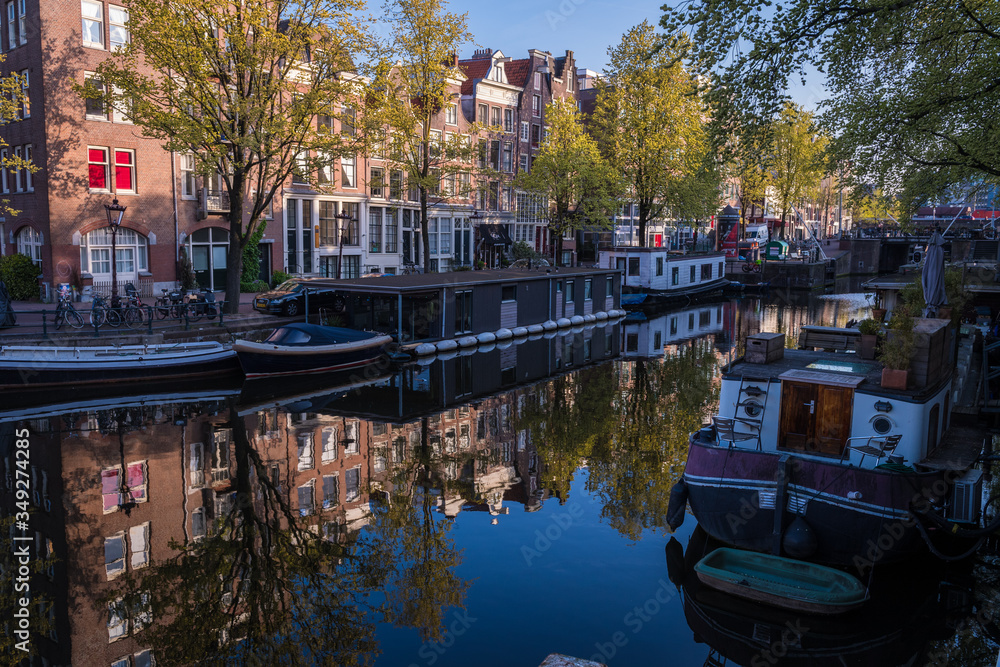 Amsterdam, Netherlands - April 2017: A shady corner on Amsterdam's canal