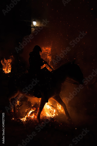 silhouette of a horse on bonfires at the festival of lights in San Bartalome de Pinares  Avila  Spain