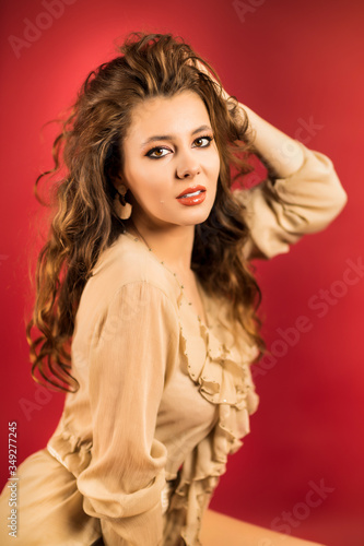 Portrait with beautiful Caucasian woman, retro fashion women in RED background.