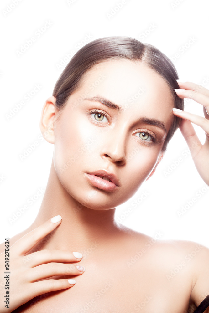 portrait of young woman with perfect skin, natural make-up, hand near hair, green eyes. Isolated. White background. Isolated