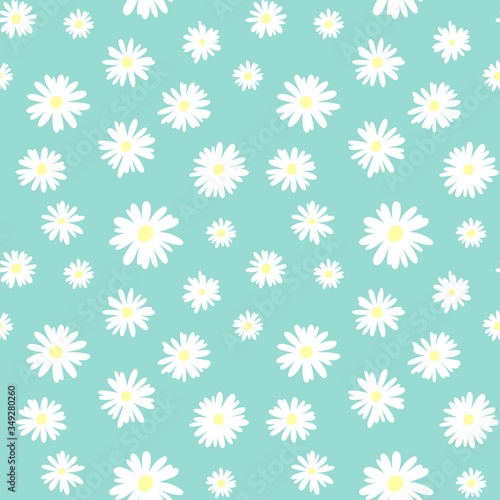 Cute seamless pattern with white chamomiles on a pastel blue background