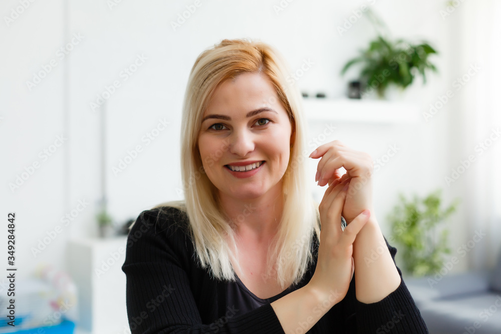 Smiling businesswoman looking at camera webcam make conference business call, recording video blog, talking with client, distance job interview, e-coaching, online training concept, headshot portrait