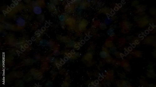multi-colored glitter falling from the sky