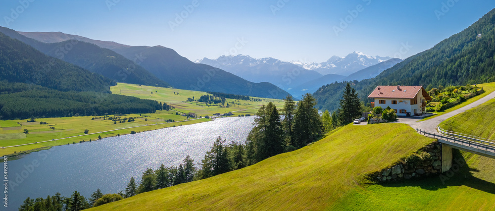 View of Lake della Muta (German: Haidersee) and Ortler Mountains in Val Venosta in the region Alto Adige in Italy. The lake lies next to Lake Resia (German: Reschensee)
