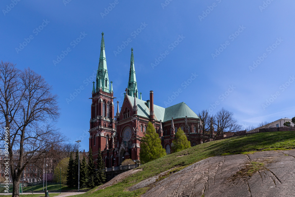 Side view of biggest red brick church in Helsinki, with no people in scene.