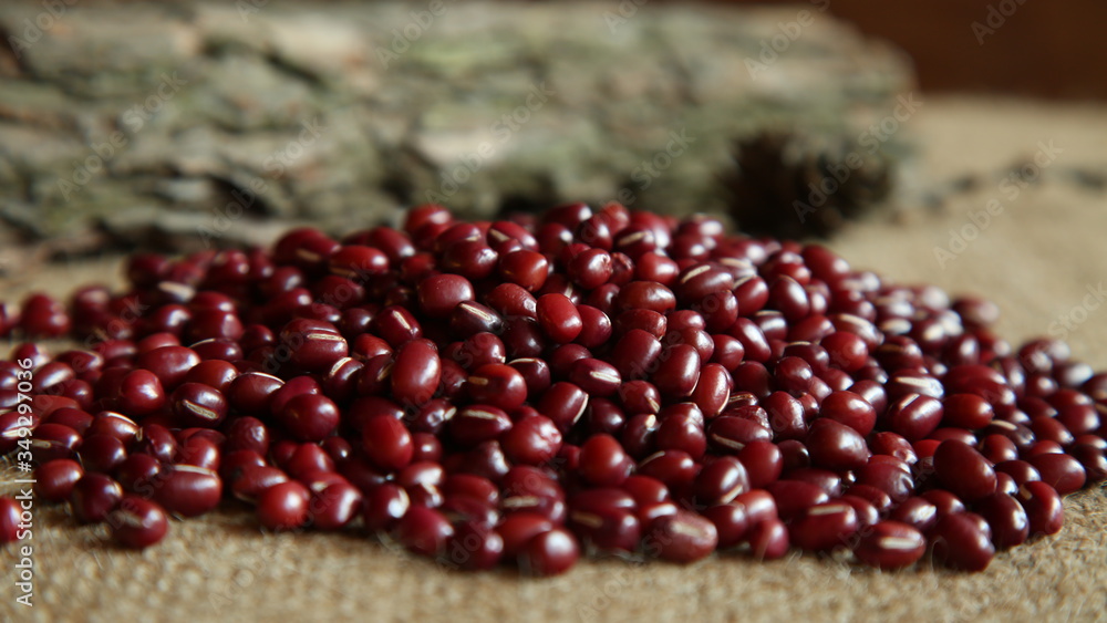 Closeup of bunch of organic red beans, spring seeds, blurred background Closeup of bunch of organic red beans, spring seeds, blurred background