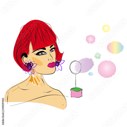 Beautiful red-haired woman blows bubbles