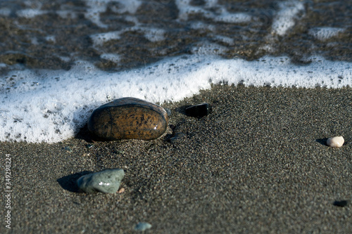 Stones on sandy beach 
