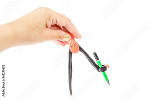 School compass in hand isolated on a white background.
