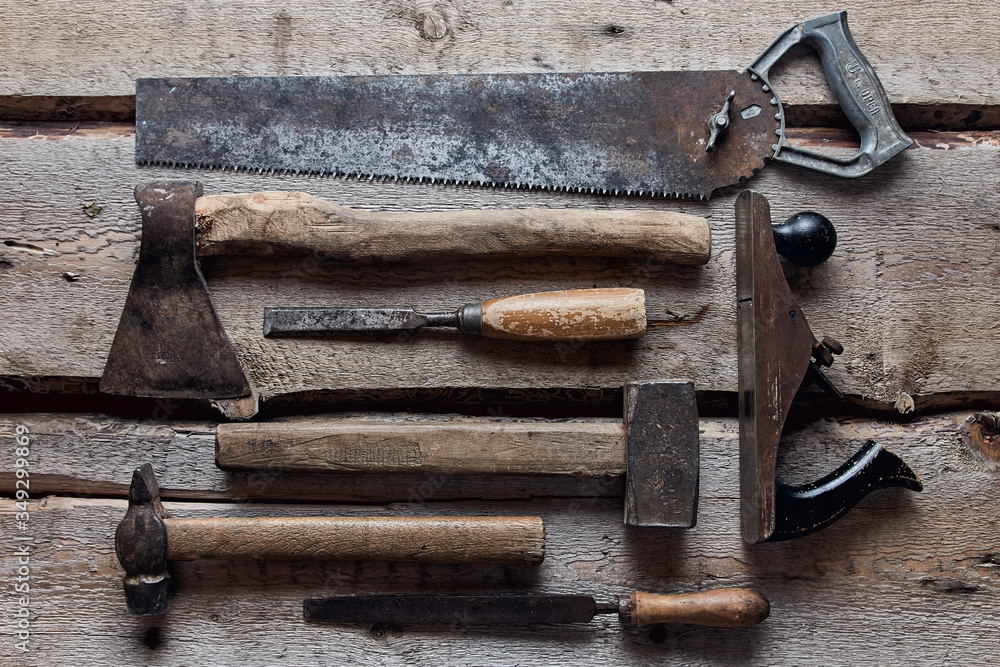 old carpentry tools on wooden background