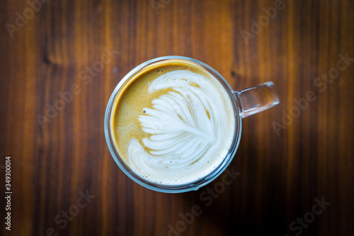 beautiful latte on a walnut table