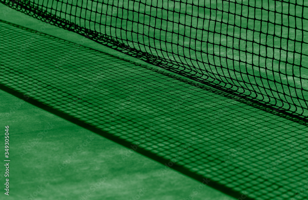 Tennis net and green court. Individual sport.. Tennis net and green court. Individual sport..