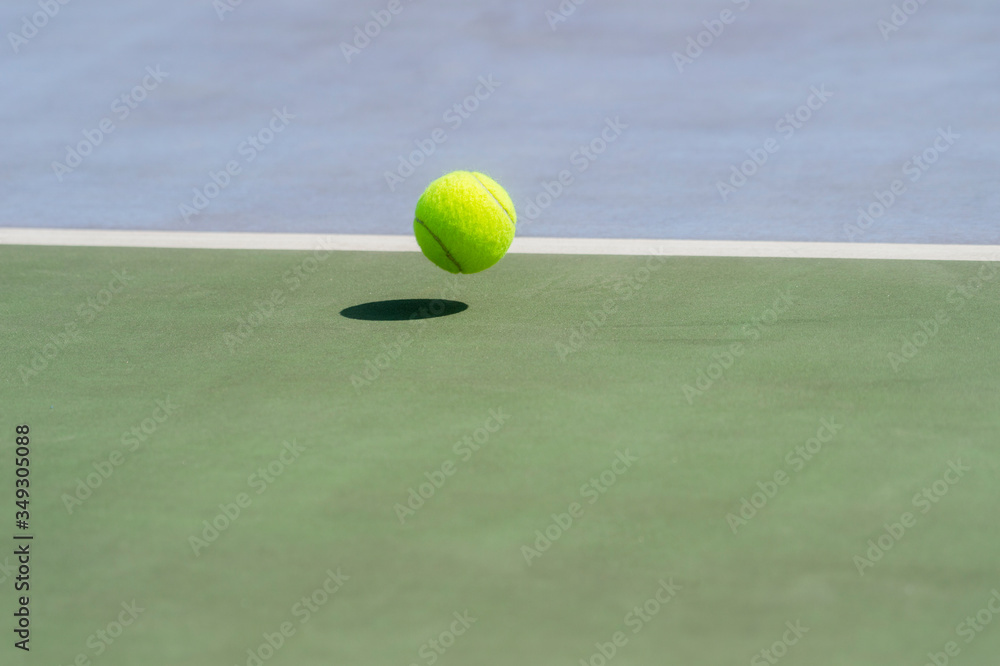 Close-Up Of A Shadow And A Tennis Ball. Individual sport