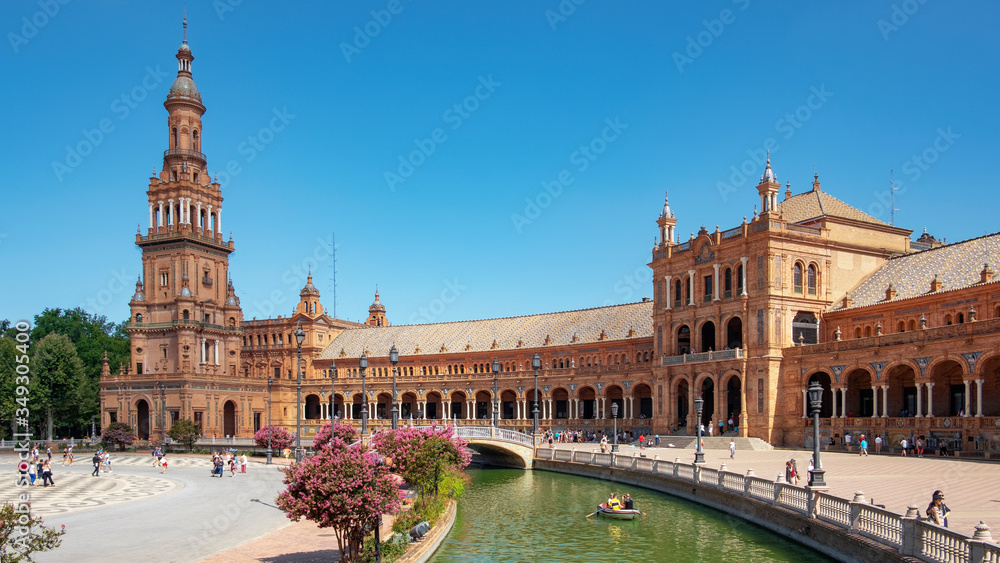 Plaza de Espana, impressive architectural complex featuring different styles and elements: water canals, bridges and two Spanish Baroque towers at each end, Seville, Andalusia, Spain