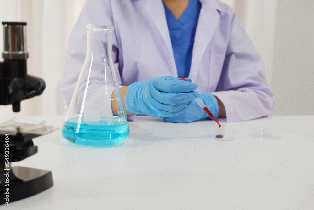 Female doctor working in laboratory for testing on vaccine for pandermic covid19 Female doctor working in laboratory for testing on vaccine for pandermic covid19