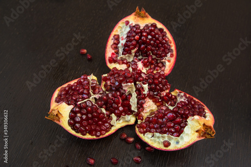 Broken into three parts of grenades lies on a dark table 