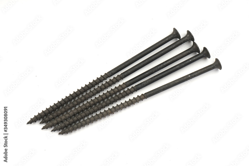 Metal screws, iron screws, wood screws isolated on white backgro Metal screws, iron screws, wood screws isolated on white backgro