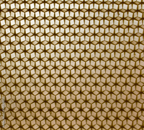 wax yellow honeycombs for bees as a background