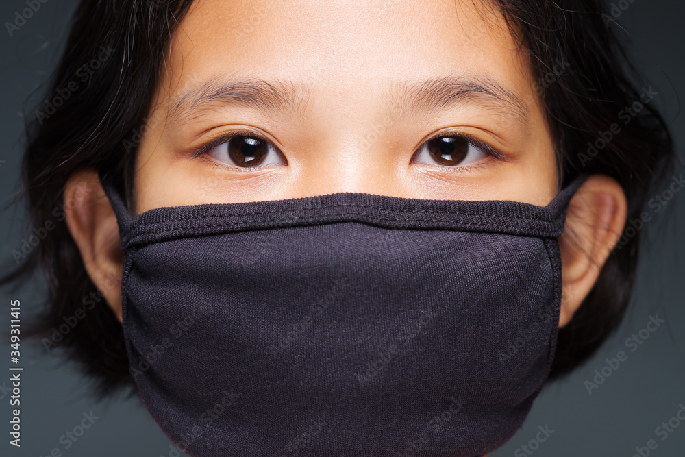Fototapeta premium Child Face in Black Mask