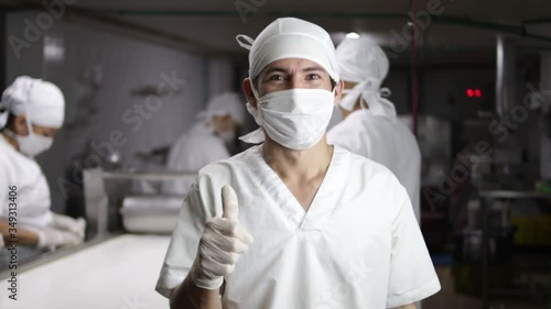 Man with mask in factory and blur background