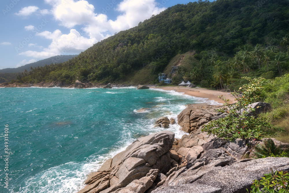 incredible beauty and the paradise secret beach of Haad Nam Tok with the azure sea and a rocky coast on the island of Ko Pha-ngan in Thailand incredible beauty and the paradise secret beach of Haad Nam Tok with the azure sea and a rocky coast on the island of Ko Pha-ngan in Thailand