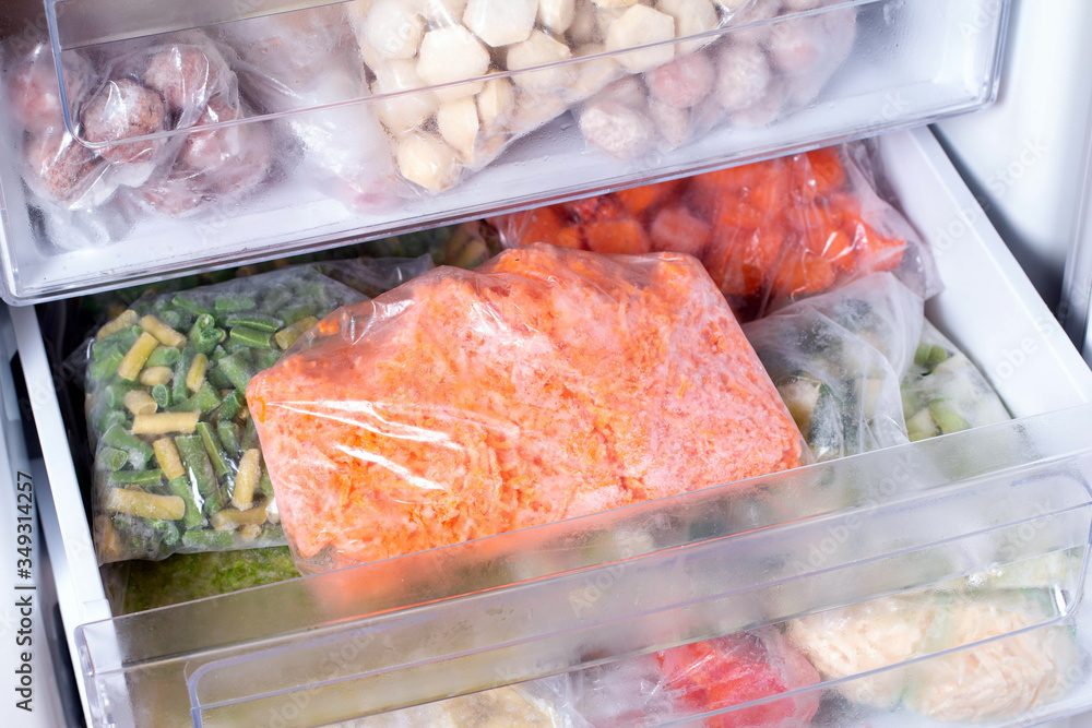 Frozen Carrot, frozen vegetables in bags in refrigerator